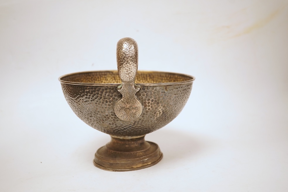 A hammered white metal two handled pedestal bowl, stamped 'Kennedy 925, diameter 18.9cm, 18.1oz.